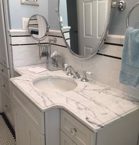 bath remodeling with granite countertops and clean design